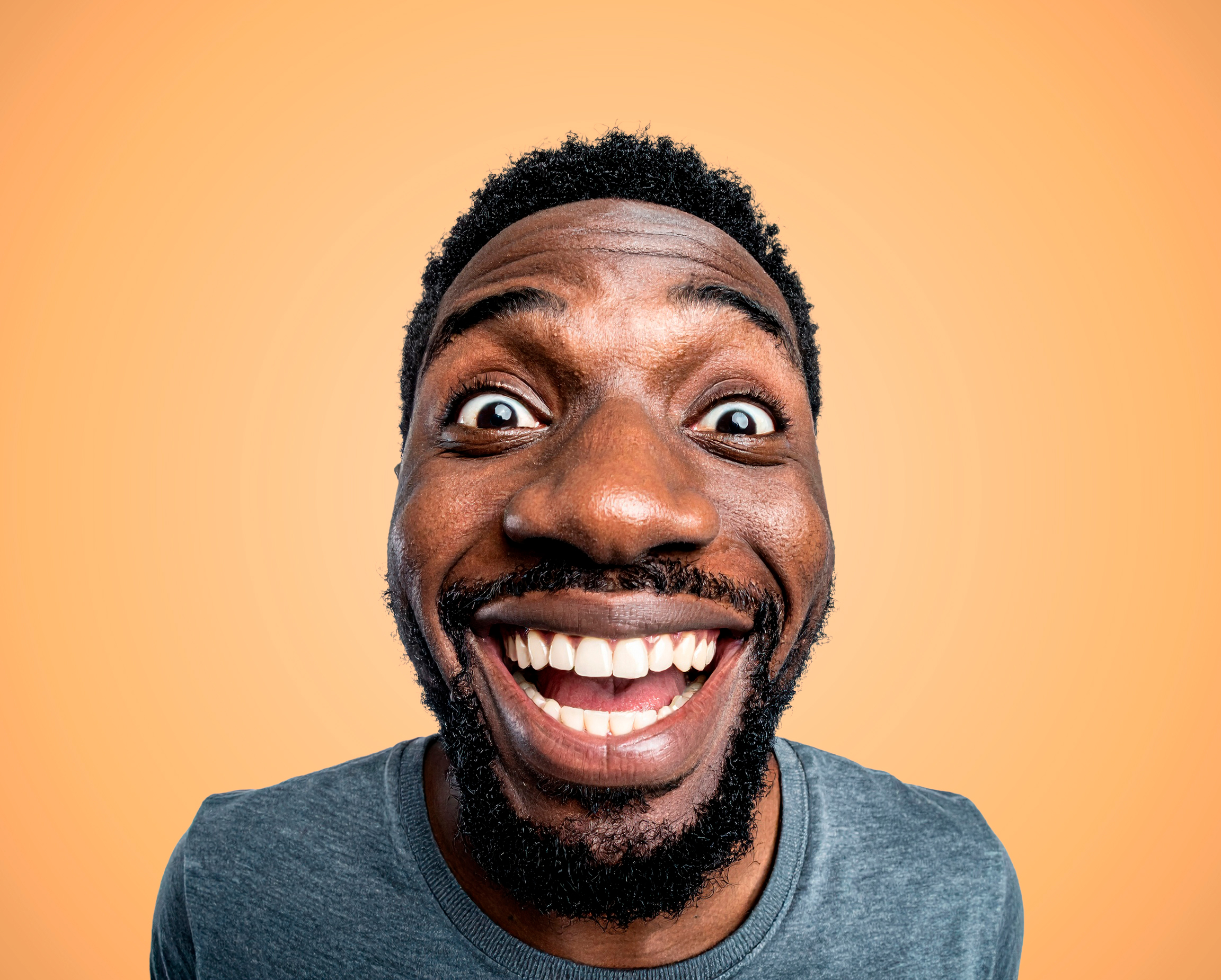 Man on orange background in pitchd brand style photography.