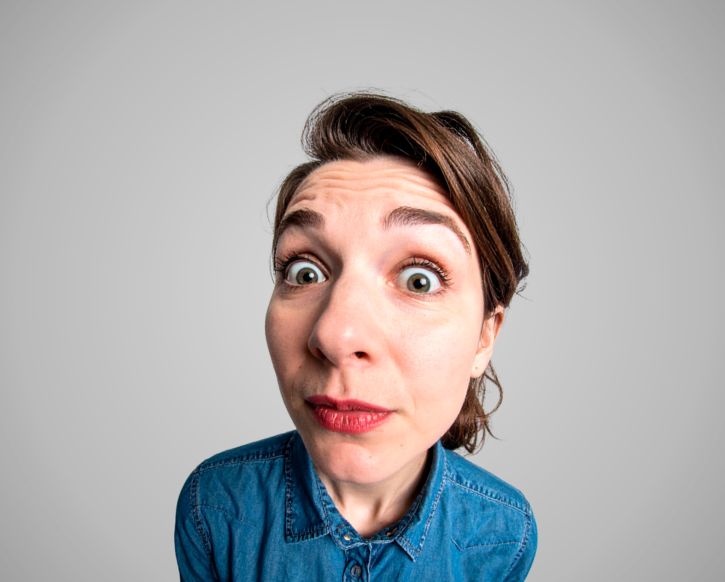 Woman on grey background in pitchd brand style photography.