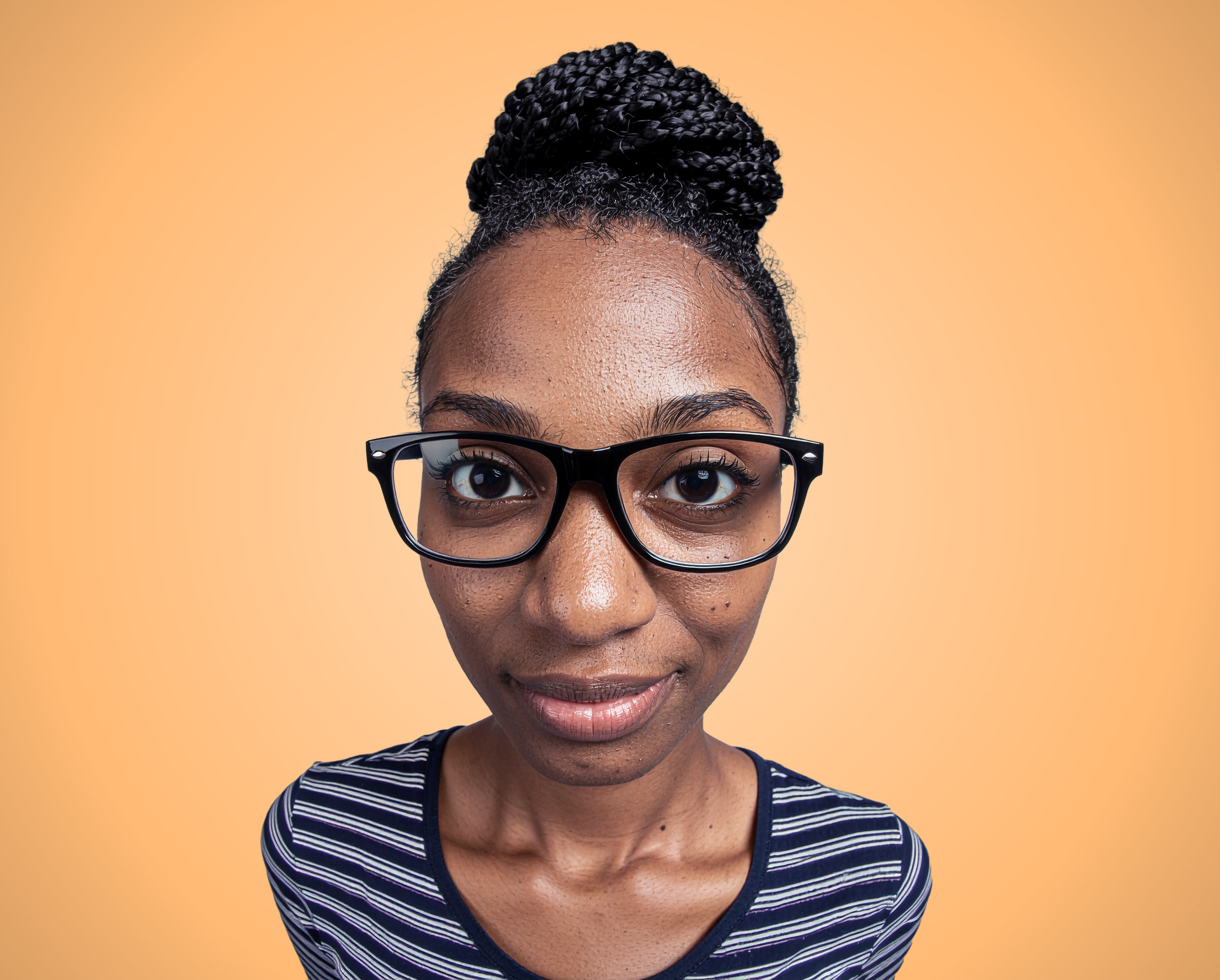 Woman on orange background in pitchd brand style photography.